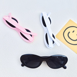 Oval retro sunglasses in black, white, and pink finishes for stylish summer sun protection