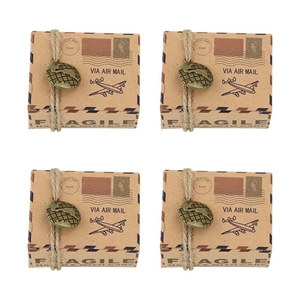 Set of four vintage airmail style kraft paper candy boxes with twine and metal globe charms