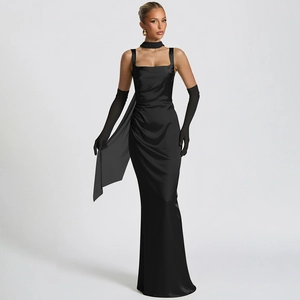 Close-up of elegant black satin evening gown with corset boning and side draping detail
