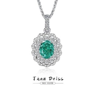 Close-up of S925 silver necklace featuring an emerald-green stone with double halo diamonds