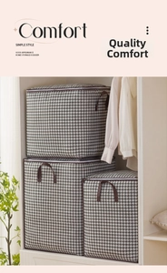 Three-piece set of houndstooth fabric storage boxes with brown handles in a white closet