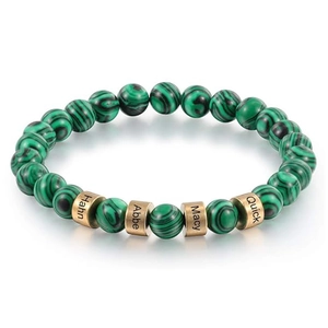 Macro detail of custom name beads on a green malachite stone beaded bracelet for men