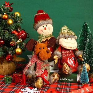 Detail of Christmas candy bags featuring reindeer, snowman and Santa with clear windows