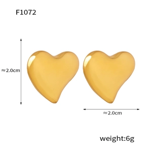 Detail shot of golden heart earrings showing 2.0cm diameter and 6g weight specifications
