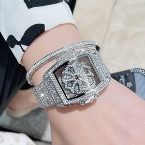 Luxury silver tonneau watch for women with spinning crystal dial and diamond bracelet