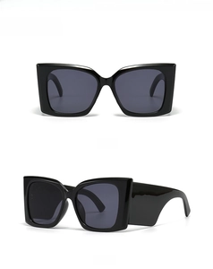 Front and 45-degree side view of oversized black square sunglasses with dark grey lenses