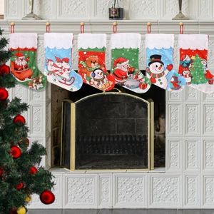 Set of 6 assorted Christmas stockings with plush cuffs hung on a fireplace mantel