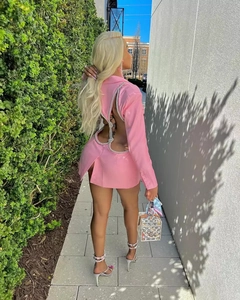 Detailed back view of pink backless mini blazer dress featuring silver rhinestone chains