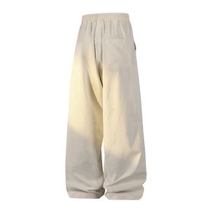 Minimalist wide-leg loose sweatpants in cream beige with elastic waist and back pocket