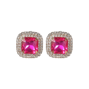 Detailed view of square fuchsia crystal earrings with halo diamonds in gold plating