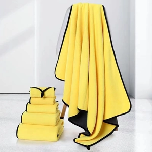 Absorbent coral fleece pet towel set in bright yellow with black border for dogs and cats