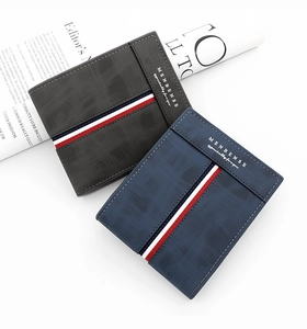 Detail of short tri-fold wallets in grey and blue PU leather with striped ribbon trim