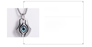 Macro detail of 316L stainless steel Evil Eye pendant showing blue eye inlay details