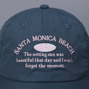 Lightweight navy nylon baseball cap with pink Santa Monica Beach embroidery detail