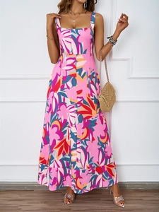 Close-up detail of the pink floral print and flowing A-line hem on the summer maxi dress