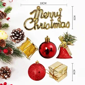Christmas DIY ornaments set with Merry Christmas sign, red bells, and gold gift boxes