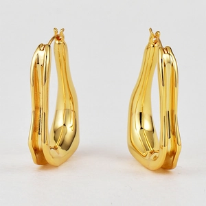 Minimalist irregular U-shaped geometric earrings in polished gold plated brass