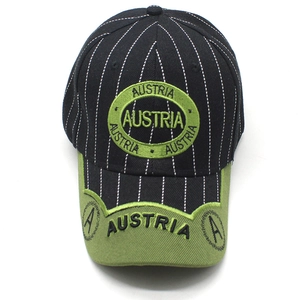 Detailed close-up of striped baseball cap with Austria embroidery and green brim detail