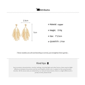 Detailed size and material diagram of golden tassel earrings showing copper specifications