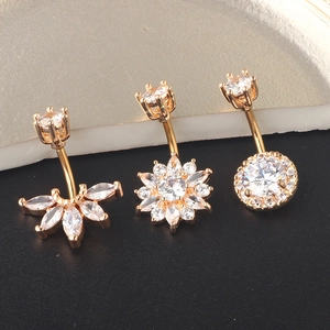 Three-piece gold belly button ring set with sparkling marquise and round zircon stones