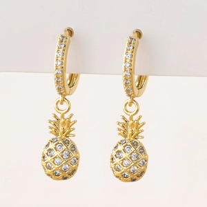Macro shot of gold pineapple drop earrings featuring pavé micro-set clear zircon crystals