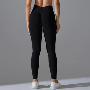 Detail view of black high-waisted leggings with V-shaped waistband and butt-lifting seams