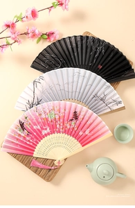 Detailed view of Chinese folding fans with bamboo bones and intricate embroidery tassels