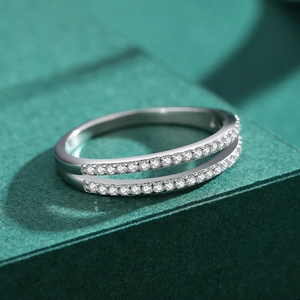 Elegant s925 silver double layer ring with sparkling cubic zirconia on a green background
