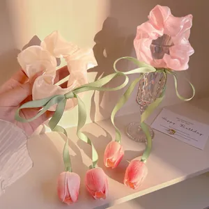 Pink organza tulip scrunchies set with long ribbons and floral charms for women