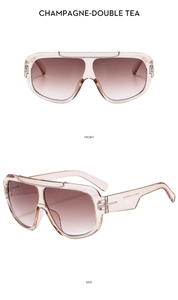 Detailed front and side views of oversized champagne sunglasses with tea gradient lenses