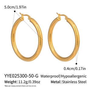 Detailed view of 50mm gold stainless steel hoop earrings with waterproof specs