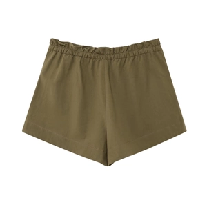Close-up of olive green casual shorts featuring elastic waist and wide hem detail
