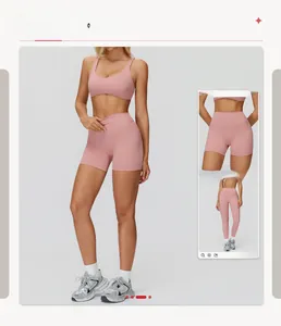 Detailed view of pink yoga bra with cross back straps and high waist sports shorts