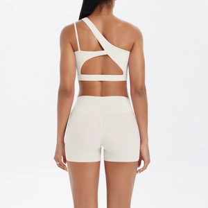 Rear view detail of one-shoulder yoga set with cutout back and high waist shorts