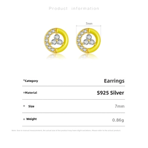 Detail of 925 sterling silver geometric earrings with yellow enamel and white zircons