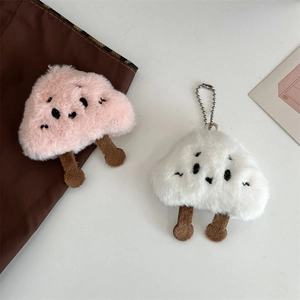 Detailed view of pink and white plush cloud keychains with soft faux fur and embroidery