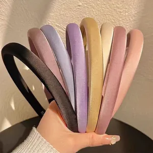 Solid color padded headband set in satin fabric for a high cranial top hairstyle