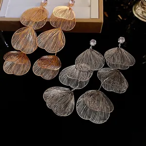 Exaggerated layered hollow flower tassel earrings with crystals in gold and silver