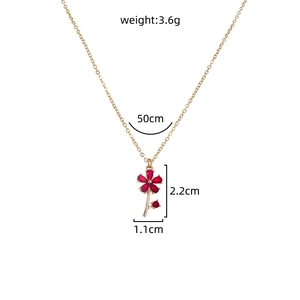 Detail showing dimensions of flower necklace with red zircon petals and golden chain