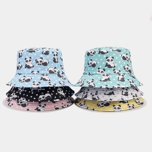 Detail showing stacked cute panda print bucket hats in various soft pastel colors