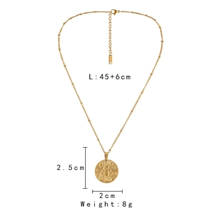Detail of gold coin zodiac necklace with 45+6cm adjustable chain and embossed pendant