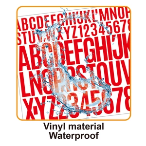Close-up of red waterproof vinyl alphabet stickers showing water splash resistance