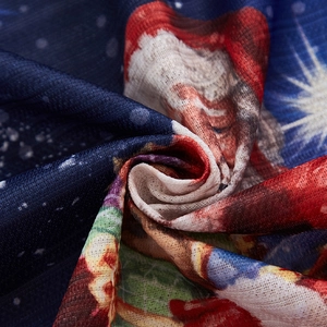 Close-up detail of high-quality Christmas curtain fabric with Santa Claus print