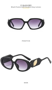 Detail view of oval sunglasses featuring golden leaf metal decor and gradient lenses