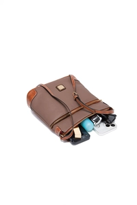 Top view of pebble grain leather crossbody bag showing spacious interior with daily items