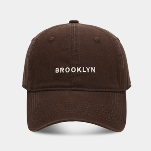 Dark brown cotton baseball cap with white Brooklyn embroidery and classic six-panel design