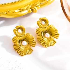 Vintage oversized gold flower earrings with white pearl center and textured petals