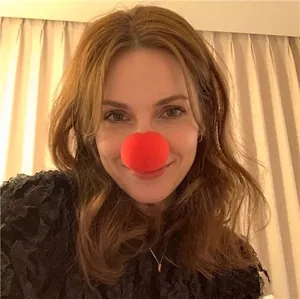 Close-up of a round red sponge clown nose for Christmas and party costume performance