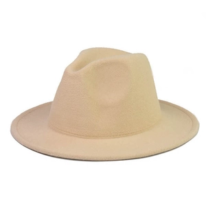 Detail of beige fedora hat texture with wide brim and classic crown indent on white background