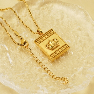Gold stainless steel square pendant necklace with crown relief on wheat chain